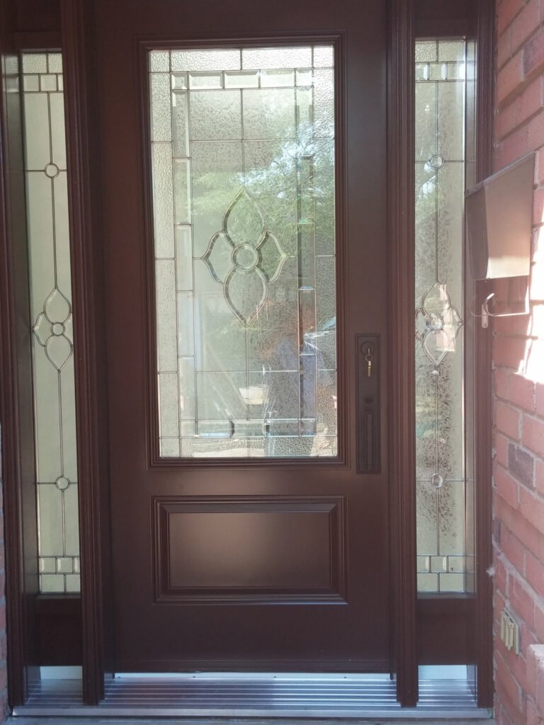 Front entry door with decorative glass insert and sidelights installed in Barrie, ON.